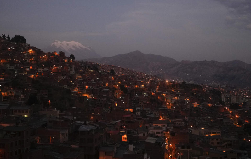 An aerial view of La Paz, Bolivia, Saturday, June 29, 2024, backdropped by the snow-capped Illimani mountain, days after Army troops stormed the government palace in what President Luis Arce called a coup attempt. (AP Photo/Juan Karita)