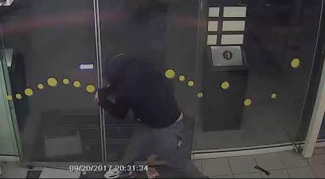 An armed robber was set back when he failed to open a service station's automatic doors in Melbourne's north. Picture: Victoria Police