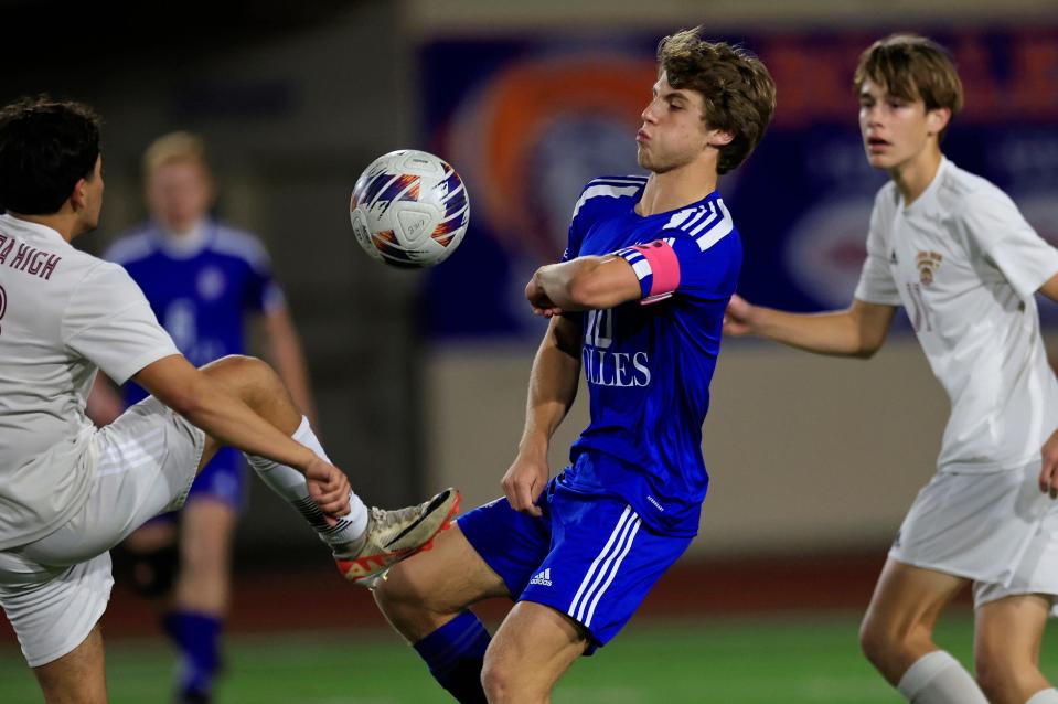 Bolles midfielder Will Morales (10) challenges for the ball against Florida High.
