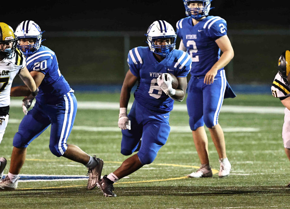 Wyoming running back Jackson Hamilton (6) runs the ball during their 31-0 win over Taylor to extend their regular season win streak to 72 breaking a state record Friday, Sept. 15, 2023.