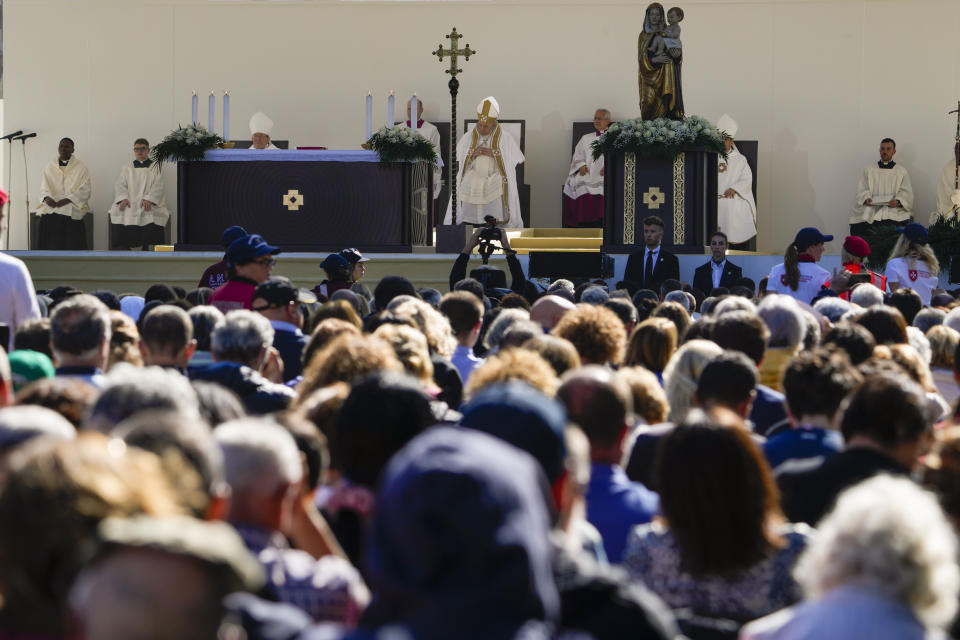 Pope Francis celebrates mass in front of the St. Mary in Collemaggio Basilica, in L'Aquila, central Italy, Sunday, Aug. 28, 2022. Pope Francis will be the first pope since Celestine V to open the St. Mary in Collemaggio Basilica Holy Door, the first in history, established with the Bull of Forgiveness of 29 September 1294 by Pope Celestine V, and start the jubilee of forgiveness. (AP Photo/Domenico Stinellis)