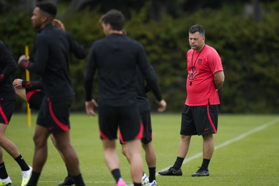 United States men's national soccer team's interim head coach B. J. Callaghan, right, watches his players warm up during practice in Carson, Calif., Monday, June 5, 2023. (AP Photo/Jae C. Hong)