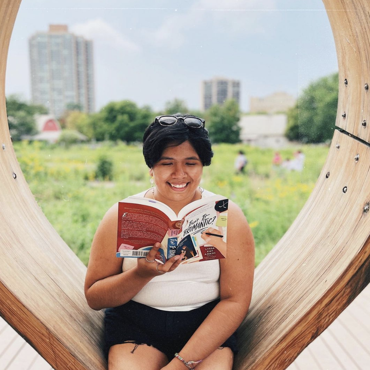 About me: My name is Carolina, but you can call me Caro! I am a bisexual, nonbinary Mexican American living in Chicago. I fell in love with reading in third grade but hadn’t read a single book for leisure since high school. I rediscovered my love for reading two years ago when I found myself having a lot of time to read on my commute on the L, so I picked up the habit again!What followers can expect: You can expect honest reviews, diverse recommendations, and (my attempts at) aesthetic photos and funny reels! I love reading YA and adult romance, science fiction, fantasy, and contemporary fiction. When you look at my page, you’ll see I showcase stories from BIPOC authors, including writers of the Latinx diaspora. I also share a bit of my non-reading life — my mental health journey, Squishmallow collection, and my Marvel obsession. I’m grateful that my account has not only been a creative outlet, but also a space to build community and make genuine friendships!A recent book I enjoyed: I recently read Zoraida Córdova’s adult debut, The Inheritance of Orquídea Divina, which was such a fantastic novel. I highly recommend it, especially if you’re a fan of family secrets and magical realism. The Inheritance of Orquídea Divina is unlike any other fiction novel I’ve read, and really sets Zoraida apart from other authors. She thrusts you straight into the life of Orquídea and her grandchildren, with little explanation, but you figure it out as the story progresses. Córdova has weaved together a story about strong women, vulnerability, resentment, and loss, and every word wholeheartedly resonated with me. Orquídea is a gritty, resilient, and beautiful woman with a wonderful family, and Zoraida’s stellar writing truly brought them to life. ⁣