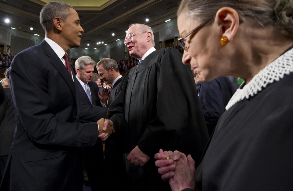 FILE - In this Jan. 24, 2012, file photo President Barack Obama greets Supreme Court Justice Anthony Kennedy and Ruth Bader Ginsburg, right, prior to his State of the Union address in front of a joint session of Congress at the Capitol in Washington. The monumental fight over a health care law that touches all Americans and divides them sharply comes before the Supreme Court Monday, March 26, 2012. (AP Photo/Saul Loeb, Pool, File)