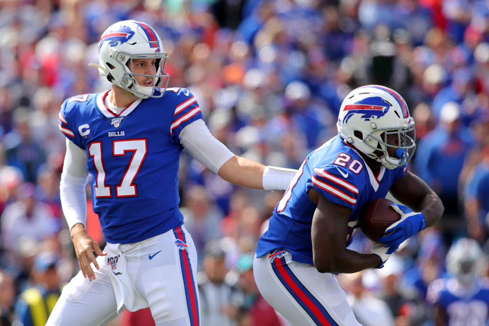 BUFFALO, NEW YORK - SEPTEMBER 29: Josh Allen #17 of the Buffalo Bills hands the ball off to Frank Gore #20 during the first quarter in the game at New Era Field on September 29, 2019 in Buffalo, New York. (Photo by Brett Carlsen/Getty Images)