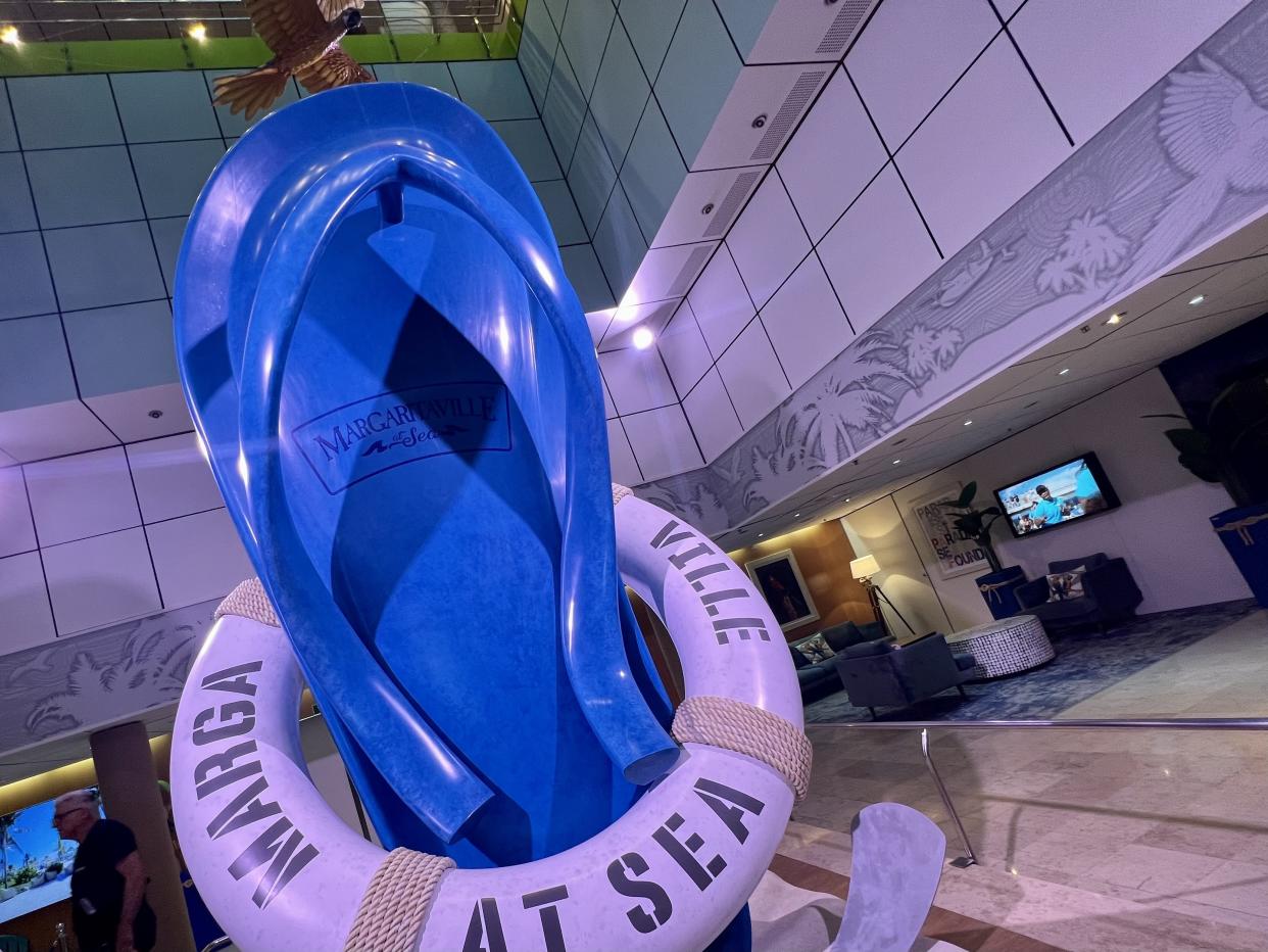 In the ship's atrium, a giant flip-flop greets guests. (Photo: Terri Peters)