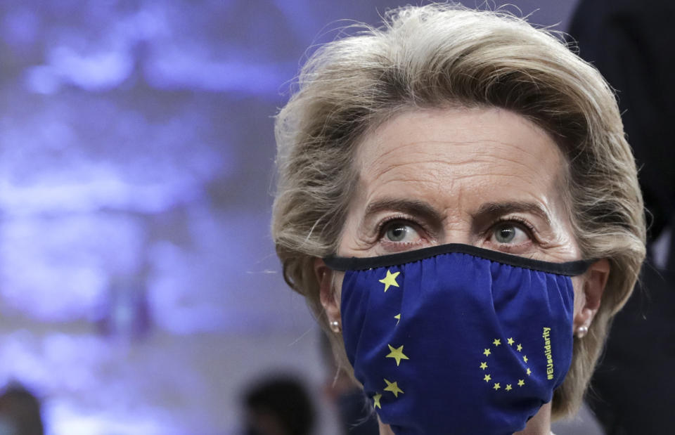 European Commission President Ursula von der Leyen wears a protective face mask with the EU stars as she waits for the start of the opening ceremony at an EU summit at the Alfandega do Porto Congress Center in Porto, Portugal, Friday, May 7, 2021. European Union leaders meet for a summit in Portugal on Friday, sending a signal they see the threat from COVID-19 on their continent as waning amid a quickening vaccine rollout. Their talks hope to repair some of the damage the coronavirus has caused in the bloc, in such areas as welfare and employment. (Tiago Petinga, Pool via AP)