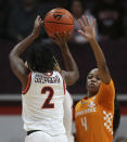 Virginia Tech's Aisha Sheppard (2) shoots a 3-point basket over Jordan Walker (4) of Tennessee in the first half of an NCAA college women's basketball game in Blacksburg Va., Sunday, Dec. 5, 2021. (Matt Gentry/The Roanoke Times via AP)