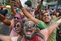 <p>Revellers pose on the first day of the Notting Hill Carnival in west London on August 28, 2016. (Photo: DANIEL LEAL-OLIVAS/AFP/Getty Images) </p>