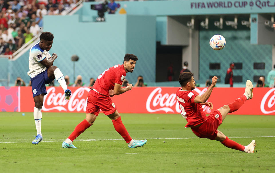 DOHA, QATAR - NOVEMBER 21: Bukayo Saka of England scores their team's second goal during the FIFA World Cup Qatar 2022 Group B match between England and IR Iran at Khalifa International Stadium on November 21, 2022 in Doha, Qatar. (Photo by Julian Finney/Getty Images)