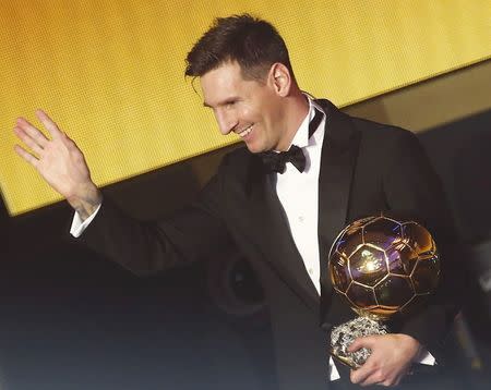 FC Barcelona's Lionel Messi of Argentina poses with the FIFA Ballon d'Or 2015 for the world player of the year during an awards ceremony in Zurich, Switzerland, January 11, 2016 REUTERS/Ruben Sprich