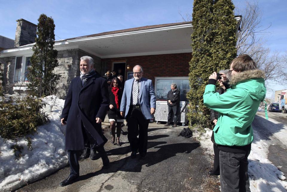 Liberal leader Couillard leaves a campaign stop in Saint-Jerome