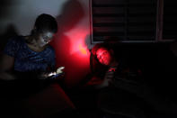 <p>Angie Rodriguez (L) sits with her grandson at their home during a blackout after Hurricane Irma rolled by the U.S. territory’s northern coast, in San Juan, Puerto Rico, Sept. 7, 2017. (Photo: Alvin Baez/Reuters) </p>