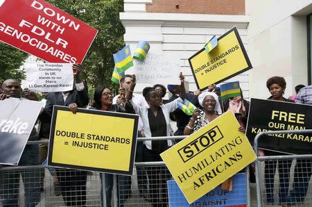 Protesters demanding the release of Rwanda's intelligence chief Karenzi Karake celebrate outside Westminster Magistrates Court after he was bailed for a bond of GB Pounds 1 Million in London, Britain June 25, 2015. REUTERS/Stefan Wermuth