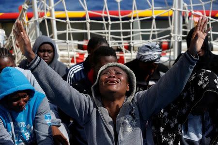 A migrant prays on the Migrant Offshore Aid Station (MOAS) ship Topaz Responder after being rescued around 20 nautical miles off the coast of Libya, June 23, 2016. REUTERS/Darrin Zammit Lupi