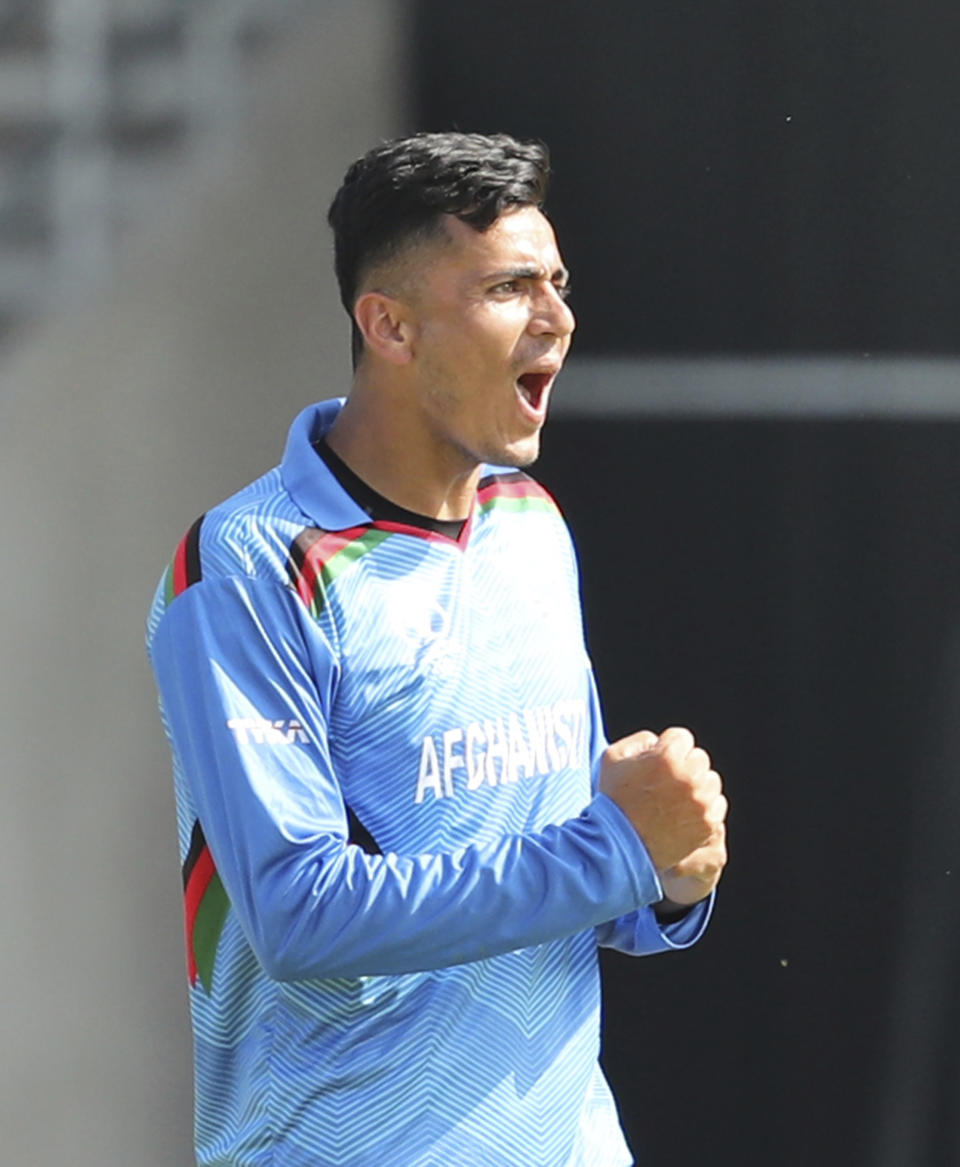 Afghanistan's Mujeeb Ur Rahman celebrates after the dismissal of Pakistan's Mohammad Hafeez during the Cricket World Cup match between Pakistan and Afghanistan at Headingley in Leeds, England, Saturday, June 29, 2019. (AP Photo/Rui Vieira)