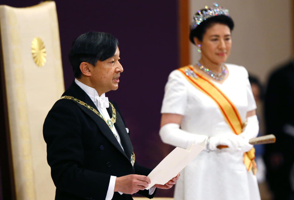 Japan's new Emperor Naruhito, accompanied by new Empress Masako, makes his first address during a ritual after succeeding his father Akihito at Imperial Palace in Tokyo, Wednesday, May 1, 2019. (Japan Pool via AP)