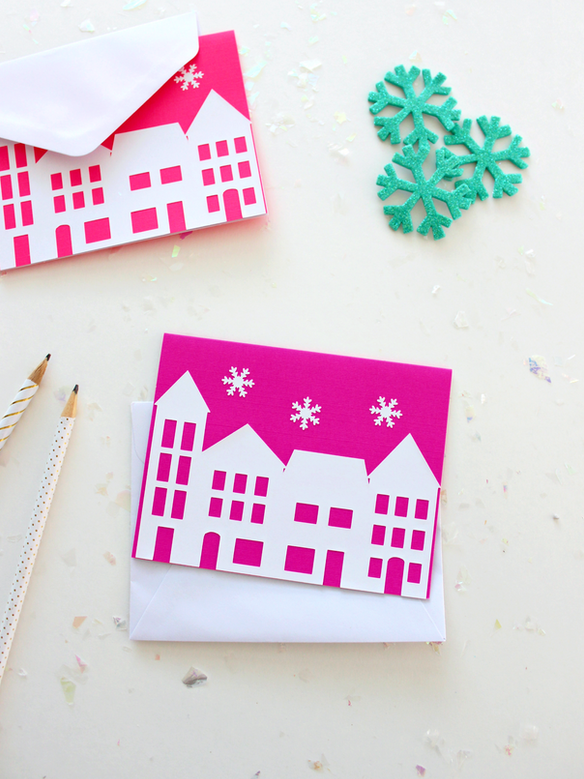 <p>Get a frosty feeling with these cut-out Christmas villages. You can use any backing color you like, from the traditional red or green to a bolder color like hot pink.</p><p><a href="https://www.whitehousecrafts.net/post/2017/11/13/easy-christmas-village-cards-with-silhouette" rel="nofollow noopener" target="_blank" data-ylk="slk:Get the tutorial at White House Crafts »;elm:context_link;itc:0;sec:content-canvas" class="link "><em>Get the tutorial at White House Crafts »</em></a></p>