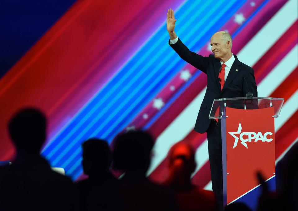 Republican Sen. Rick Scott of Florida waves to the crowd while addressing attendees at the 2022 Conservative Political Action Conference at the Rosen Shingle Creek on February 26, 2022 in Orlando, Florida.