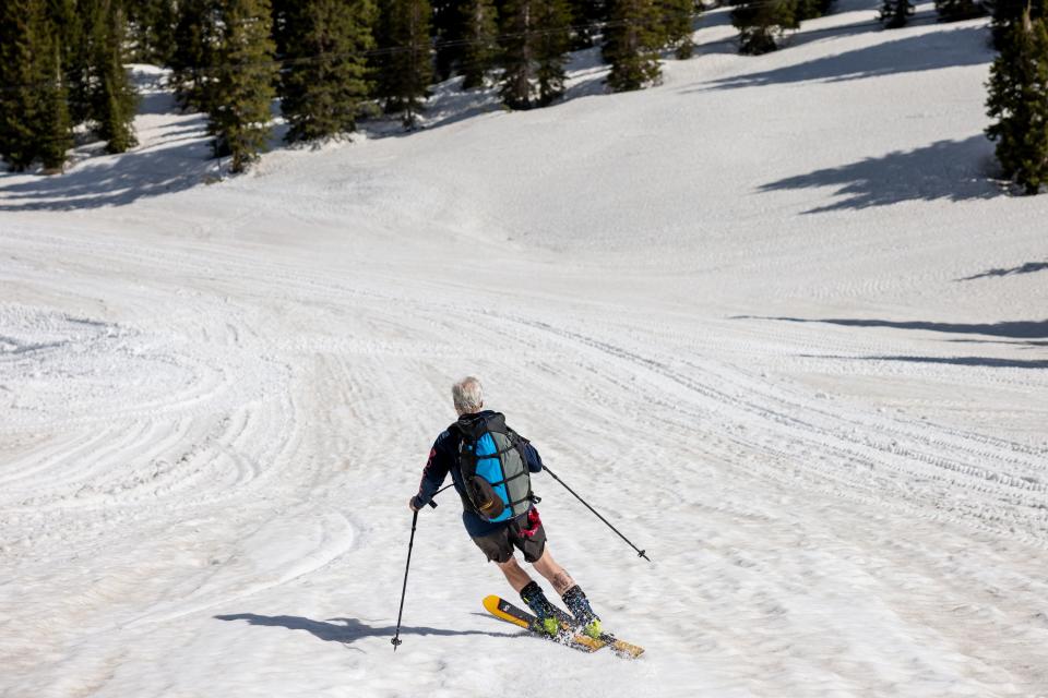 Dan Schilling, a special operations veteran and bestselling author, skis down the slopes at Alta Ski Area, which has closed for the season, after speed riding down from a higher ridge on Wednesday, May 17, 2023. | Spenser Heaps, Deseret News