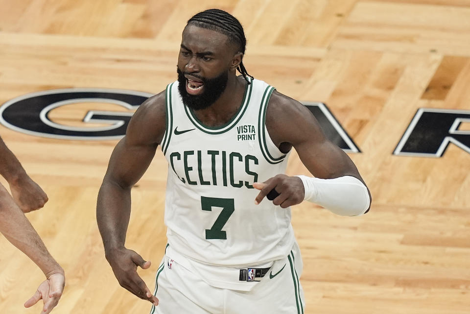 Boston Celtics guard Jaylen Brown (7) reacts after making a 3-point shot against the Indiana Pacers to tie the game with seconds left in regulation of Game 1 of the NBA Eastern Conference basketball finals, Tuesday, May 21, 2024, in Boston. (AP Photo/Michael Dwyer)