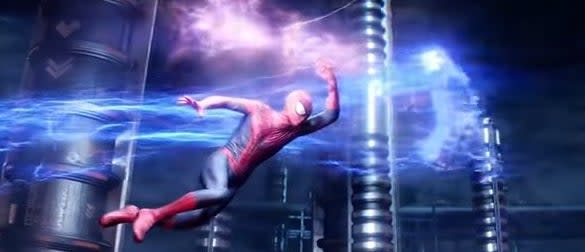 Spider-Man swinging through a power grid with Electro flying past him in "The Amazing Spider-Man 2"