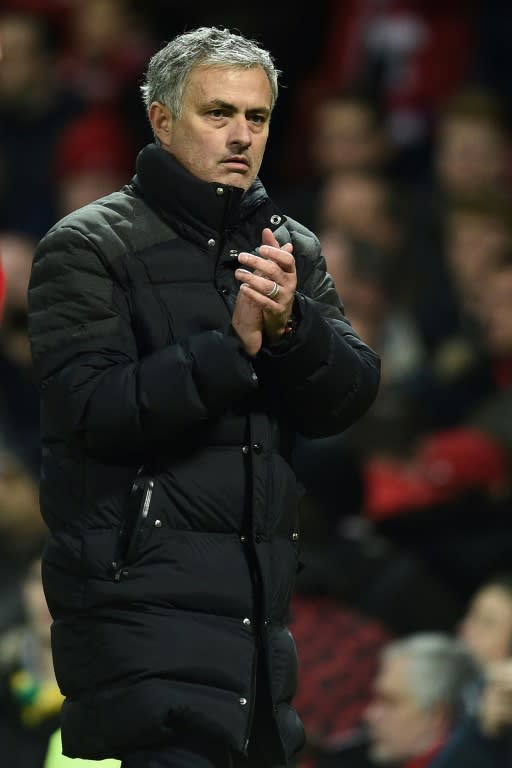 Manchester United's Portuguese manager Jose Mourinho applauds supporters as he leaves the pitch after the English Premier League football match against Liverpool January 15, 2017