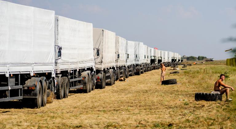 A Russian humanitarian convoy waits outside Voronezh, some 400 km outside Moscow, on August 13, 2014