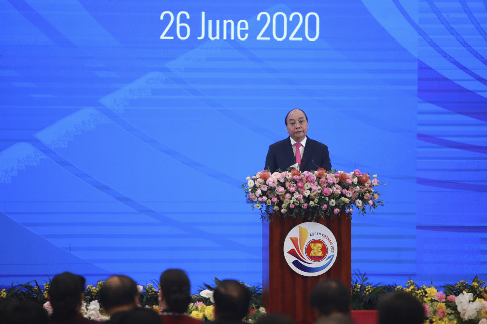 Vietnamese Prime Minister Nguyen Xuan Phuc delivers a speech at the opening ceremony of the 36th ASEAN Summit in Hanoi, Vietnam Friday, June 26, 2020. Leaders from the Southeast Asian ten-nation bloc hold the bi-annual summit via online video conference to discuss regional issues. (AP Photo/Hau Dinh)