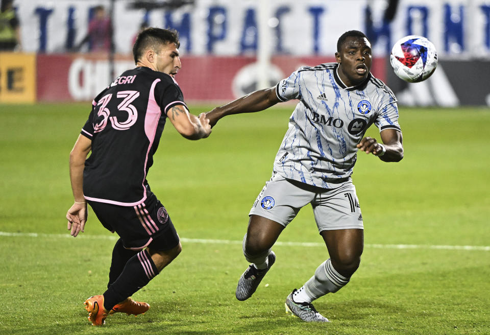 CF Montreal's Sunusi Ibrahim, right, challenges Inter Miami's Franco Negri for the ball during the second half of an MLS soccer match, in Montreal, Saturday, May 27, 2023. (Graham Hughes/The Canadian Press via AP)