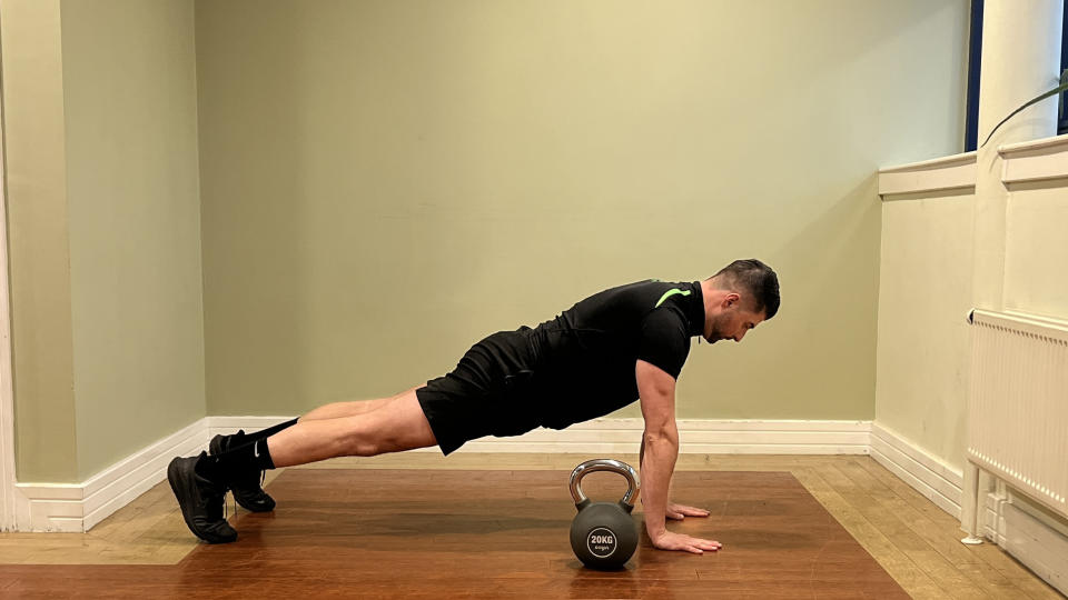 Sam Quinn, strength coach from Nuffield Health, demonstrates a kettlebell pull through