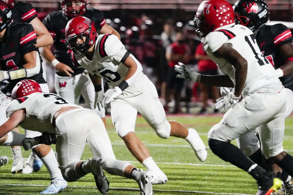 Oak Hills linebacker Max Rhodes (10) runs during the fourth quarter of a high school football game with Lakota West Friday, Sept. 9, 2022.