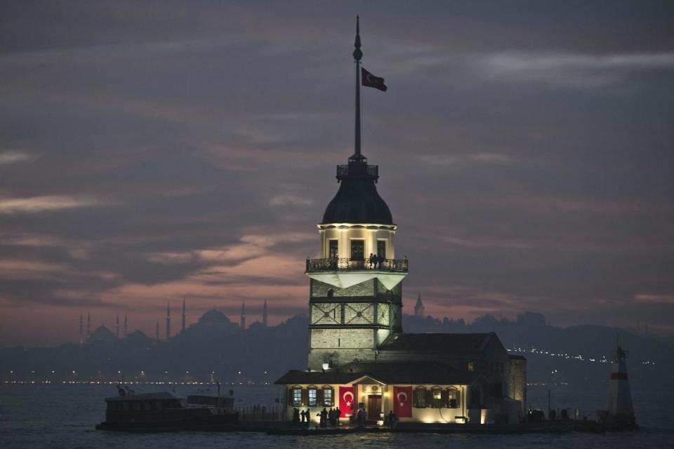 The Maiden's Tower in the Bosporus with the city's landmark mosques in the background are seen in Istanbul, Turkey, Monday, Oct. 28, 2013. Last summer, Istanbul’s Taksim Square was the scene of violent confrontations between police and protesters. But protests have faded, and contrary to some lingering perceptions, it’s quite calm now _ except for the normal hustle and bustle found in this vibrant city. And it’s as safe for tourists as it ever was. Istanbul is a thoroughly modern place, but it traces its roots back to 660 B.C. It’s the former seat of the opulent Byzantine and Ottoman empires and is divided into European and Asian sides by the Bosporus Strait, offering a wealth of history and stunning scenery.(AP Photo)