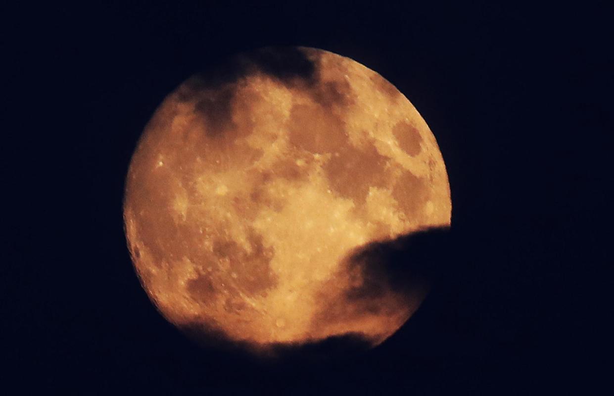 The moon (pictured during an eclipse in July) has got ice on it, a NASA mission: PA Wire/PA Images