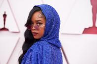 <p>H.E.R's top-to-toe purple look was completed with a striking graphic cat eye and matte tonal lip. </p>