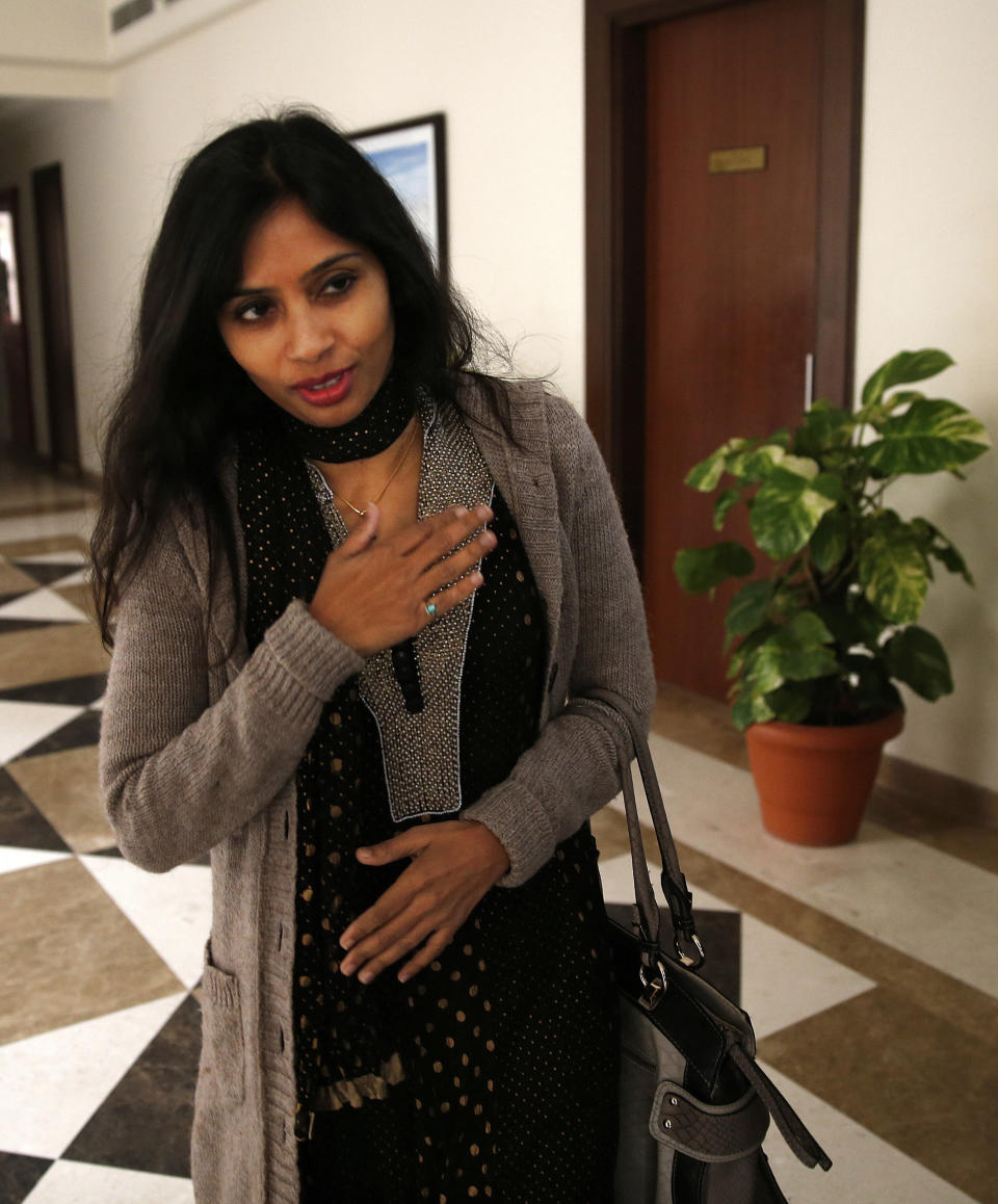 Devyani Khobragade, who served as India’s deputy consul general in New York, greets journalists as she leaves Maharastra Sadan state house in New Delhi, India, Saturday, Jan. 11, 2014. Khobragade, 39, is accused of exploiting her Indian-born housekeeper and nanny, allegedly having her work more than 100 hours a week for low pay and lying about it on a visa form. Khobragade has maintained her innocence, and Indian officials have described her treatment as barbaric. (AP Photo/Saurabh Das)