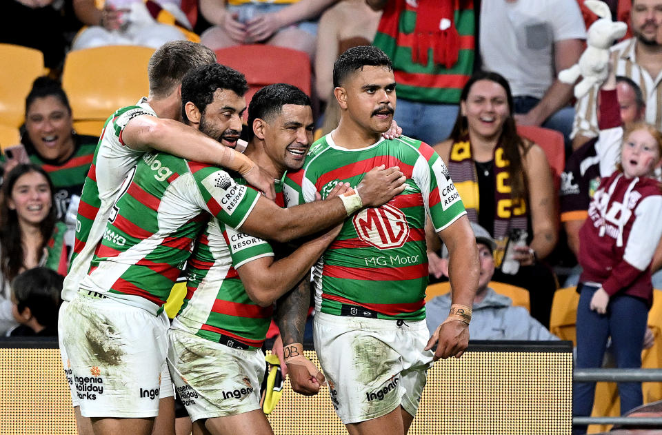 BRISBANE, AUSTRALIA - APRIL 28: Latrell Mitchell of the Rabbitohs celebrates with team mates after scoring a try during the round nine NRL match between Brisbane Broncos and South Sydney Rabbitohs at Suncorp Stadium on April 28, 2023 in Brisbane, Australia. (Photo by Bradley Kanaris/Getty Images)