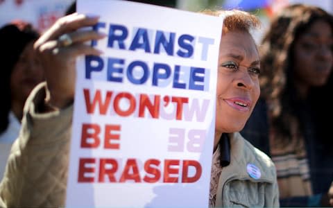 Protesters react to plans to introduce a strict definition of gender based on a person's genitalia at birth - Credit: Chip Somodevilla/Getty Images