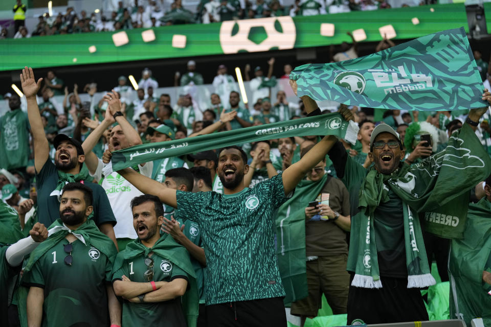 Saudi Arabia fans cheer prior of the World Cup group C soccer match between Poland and Saudi Arabia, at the Education City Stadium in Al Rayyan , Qatar, Saturday, Nov. 26, 2022. (AP Photo/Francisco Seco)