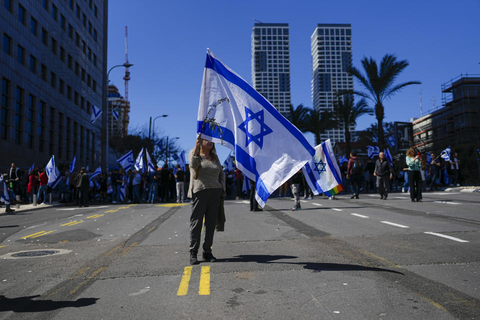 Israelis protest against plans by Prime Minister Benjamin Netanyahu's new government to overhaul the judicial system, in Tel Aviv, Israel, Thursday, March 16, 2023. (AP Photo/Ohad Zwigenberg)