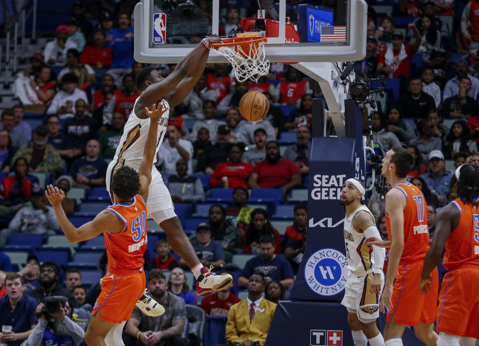 New Orleans Pelicans forward Zion Williamson (1) dunks over Oklahoma City Thunder forward Jeremiah Robinson-Earl in the first quarter of an NBA basketball game in New Orleans, Monday, Nov. 28, 2022. (AP Photo/Derick Hingle)