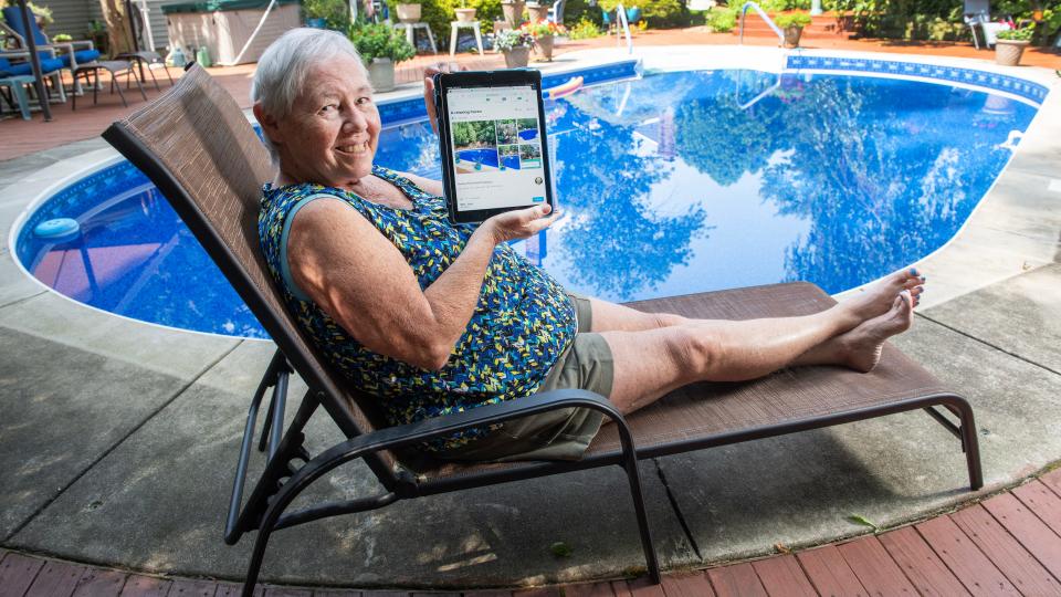 Sharon Hardy of Cherry Hill sits by her backyard pool.  Hardy has been using a website called Swimply to allow others to rent her pool. 