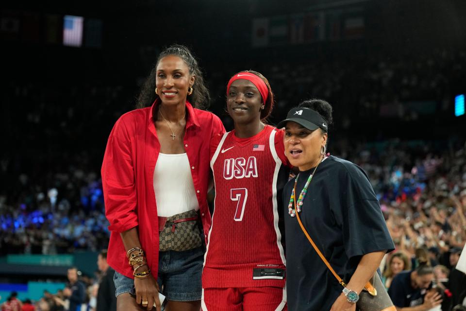 Aug 11, 2024; Paris, France; United States forward Kahleah Copper (7) poses with Lisa Leslie and Dawn Staley after defeating France in the women's gold medal game during the Paris 2024 Olympic Summer Games at Accor Arena. Mandatory Credit: Kyle Terada-USA TODAY Sports ORG XMIT: OLY-890073 ORIG FILE ID: 20240811_lbm_yz1_170.JPG