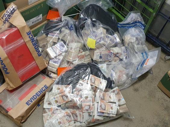 Bags of cash found as part of seizure of a suspected £1m in criminal proceeds in London on 26 May (Metropolitan Police)