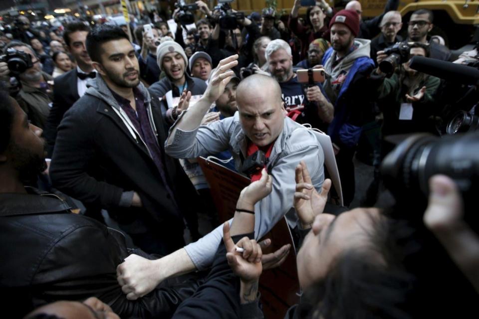 Supporters and protesters fight