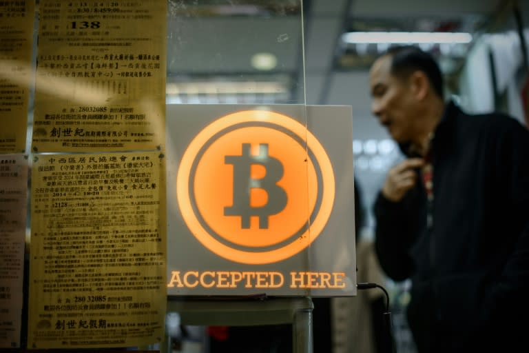 A bitcoin sign is displayed in a shop in Hong Kong