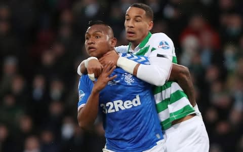 Rangers' Alfredo Morelos in action with Celtic's Christopher Jullien - Credit: REUTERS/Russell Cheyne