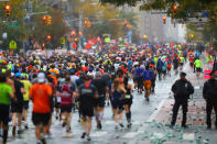 <p>A pack of runners reach First Ave. just past mile 16 of the 2017 New York City Marathon, Nov. 5, 2017. (Photo: Gordon Donovan/Yahoo News) </p>