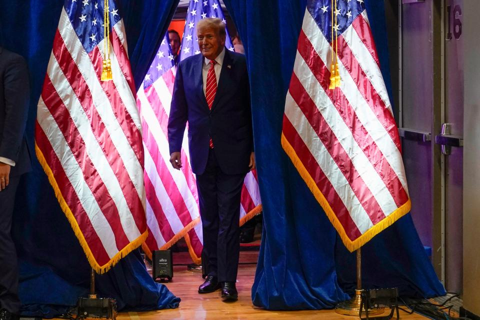 Republican presidential candidate former President Donald Trump arrives to speak at a commit to caucus rally, Saturday, Jan. 6, 2024, in Clinton, Iowa. (AP Photo/Charlie Neibergall)