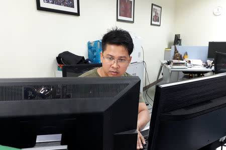 Reuters journalist Wa Lone, who was arrested in Myanmar, is seen at Reuters office in Yangon, Myanmar March 14, 2017. REUTERS/Antoni Slodkowski